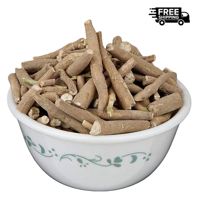 May include: A white ceramic bowl filled with tan-colored, dried ashwagandha roots. The bowl has a delicate green floral design around the rim. The image includes a "FREE SHIPPING" graphic.