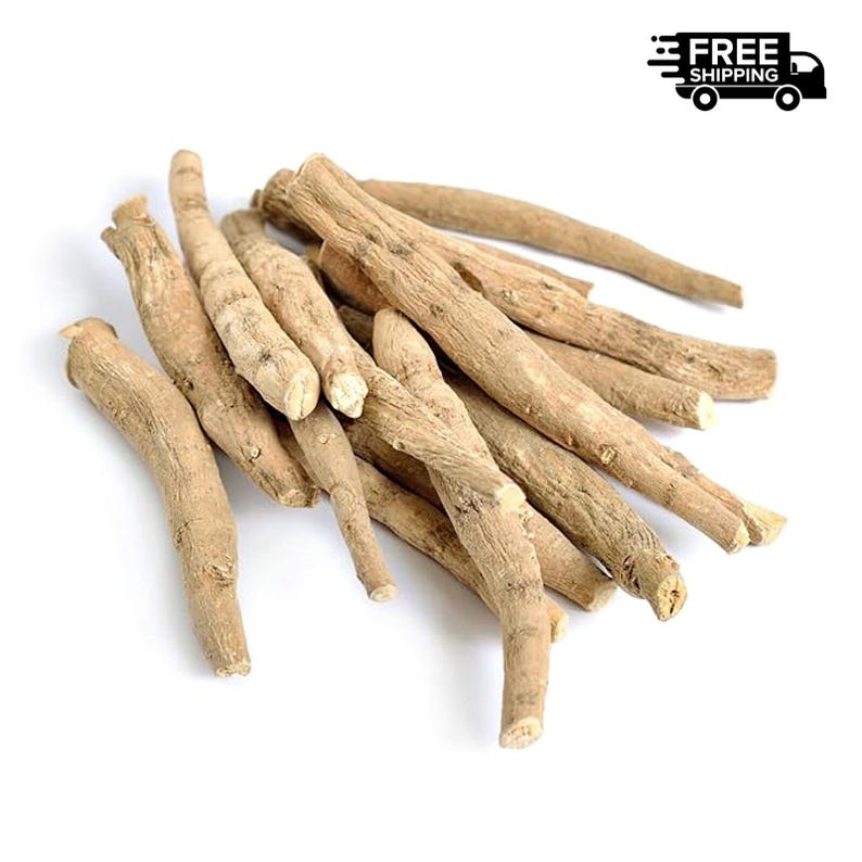 May include: A pile of light brown ashwagandha roots, with a rough, textured appearance. The roots vary in size and shape, with some being thicker and others more slender. The background is plain white.
