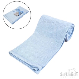 May include: A light blue baby blanket, knitted with a soft texture. The blanket is rolled up and also shown folded with a blue ribbon and tag. The blanket is made by Soft Touch Babywear.