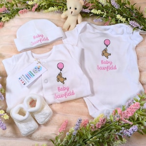 personalised girls sleepsuit with embroidered winnie the pooh design in pink