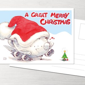Könnte beinhalten: Weihnachtskarte mit einem Cartoon-Flugzeug, das einen Weihnachtsmannhut trägt. Auf der Karte steht "A Great Merry Christmas" in Rot. Ein kleiner Weihnachtsbaum ist ebenfalls abgebildet.