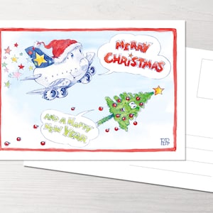 Könnte beinhalten: Eine Weihnachtskarte mit einem Cartoon-Flugzeug, das einen Weihnachtsmann-Hut trägt und an einem Weihnachtsbaum vorbeifliegt, mit dem Text "Frohe Weihnachten und ein glückliches neues Jahr".