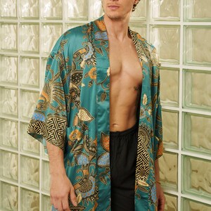 Man wearing teal satin kimono robe handmade in Bali. Long dressing gown is perfect for gifting.