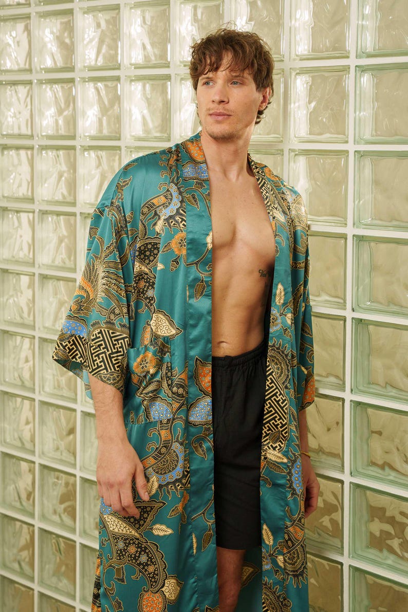 Man wearing teal satin kimono robe handmade in Bali. Long dressing gown is perfect for gifting.