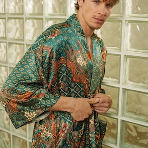 Mens green kimono robe styled indoors against glass wall