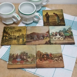 May include: Set of six square ceramic coasters featuring vintage illustrations of horse-drawn carriages and people in period clothing. The coasters are decorated with a green and white border and depict a variety of scenes, including a couple walking in a field, a horse-drawn carriage with passengers, and a group of people gathered around a carriage.