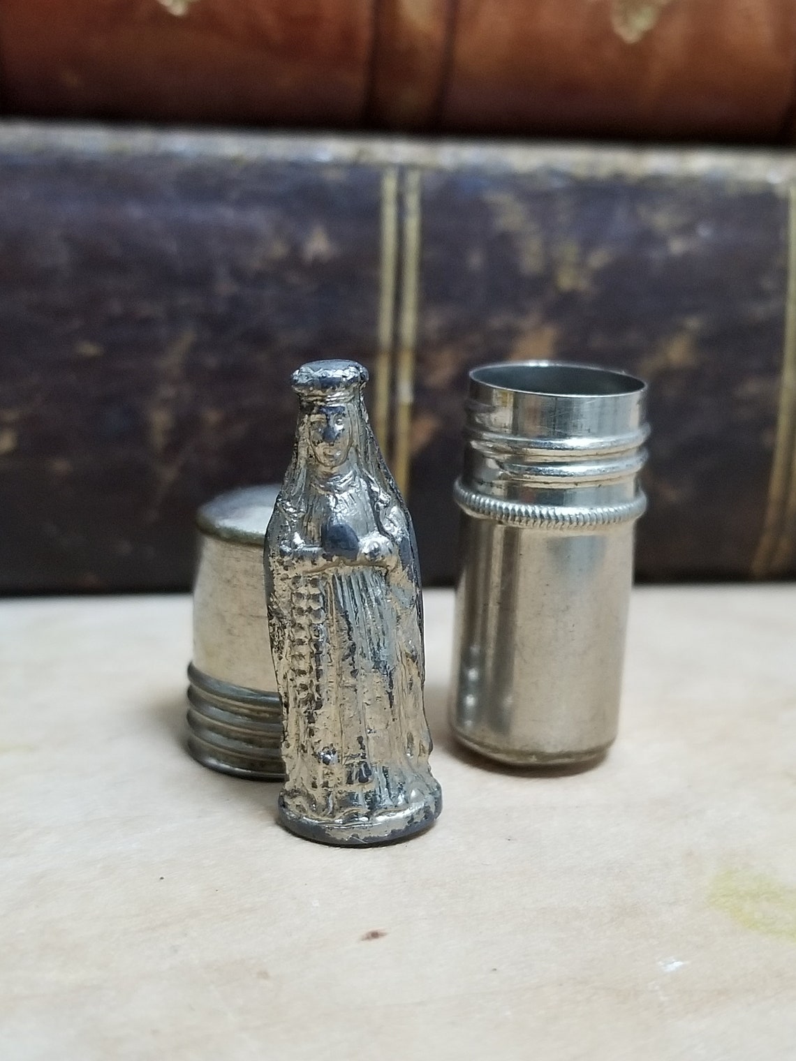 Vintage Tiny Mary Metal Figure in Little Metal Pocket Case. image 0