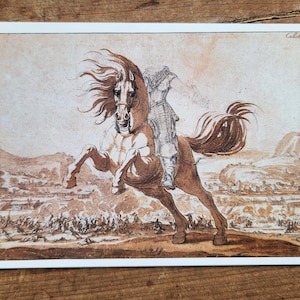 May include: Sepia print depicting a rearing horse and rider, set against a battle scene and rolling hills. The horse's mane and tail are flowing. The artwork is framed with a white border. The artist's name is visible.