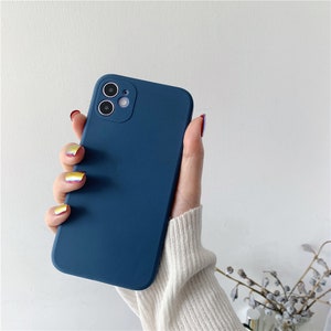 May include: A solid blue phone case with a camera cutout. The case is made of a soft, flexible material and has a smooth finish.