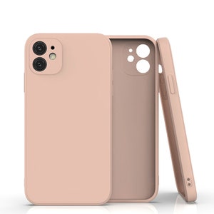May include: A blush pink silicone phone case for an iPhone with a camera cutout. The case is shown from three angles.