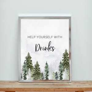 May include: A rectangular sign in a silver frame featuring a watercolour illustration of green pine trees at the bottom. The text HELP YOURSELF WITH Drinks is printed in black in the centre against a white background with light grey shading.