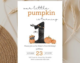 May include: A white invitation card with the text "our little pumpkin is turning" in black and orange. The number "1" is decorated with stars and a bat. The invitation is for Blake's First Birthday, October 23rd at 10 PM.