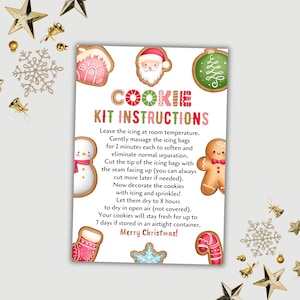 May include: A Christmas cookie kit instruction sheet with festive illustrations. The sheet features gingerbread cookies, a snowman, Santa Claus, and other holiday-themed cookies. Text includes instructions and a "Merry Christmas!" message.