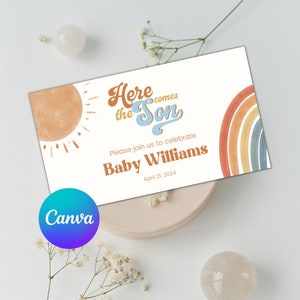 May include: A baby shower invitation with a retro design. The invitation features the text "Here Comes the Son" in a stylized font, along with the name "Baby Williams" and the date April 21, 2024. The design includes a sun and rainbow illustration.