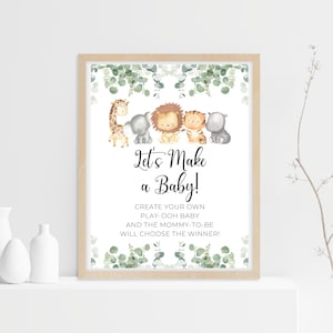 May include: A printable sign with a jungle theme for a baby shower. It features a giraffe, elephant, lion, tiger, and hippopotamus. The text reads "Let's Make a Baby! Create your own play-doh baby and the mommy-to-be will choose the winner!"