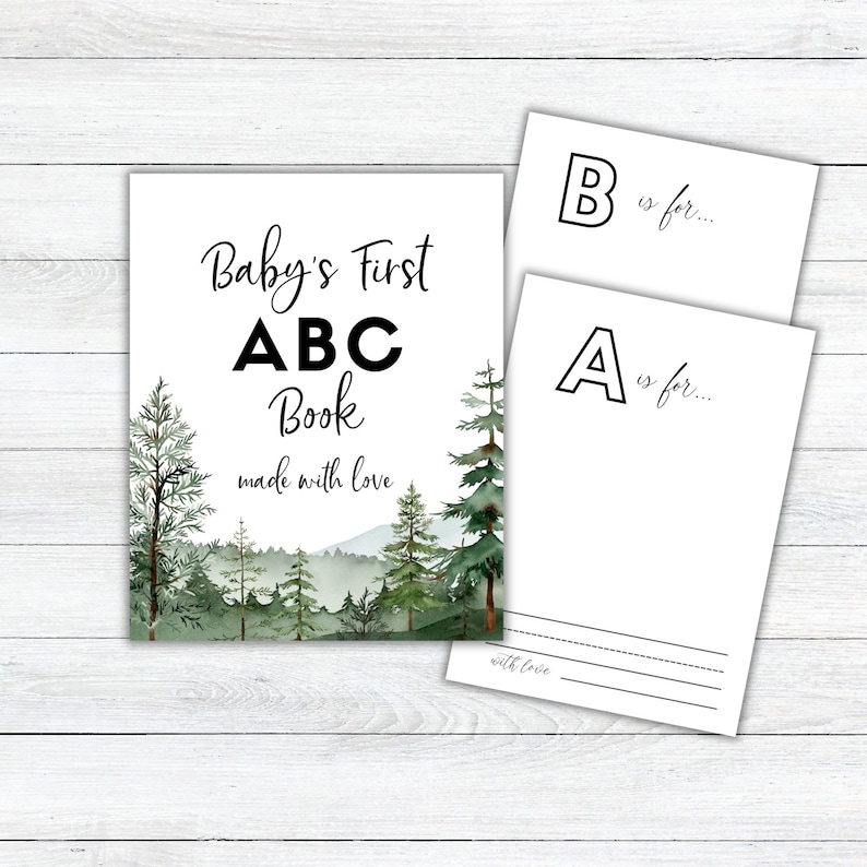 Może przedstawiać: Drukowana książeczka ABC dla niemowląt z akwarelową sceną lasu. Okładka zawiera napis "Baby's First ABC Book made with love".