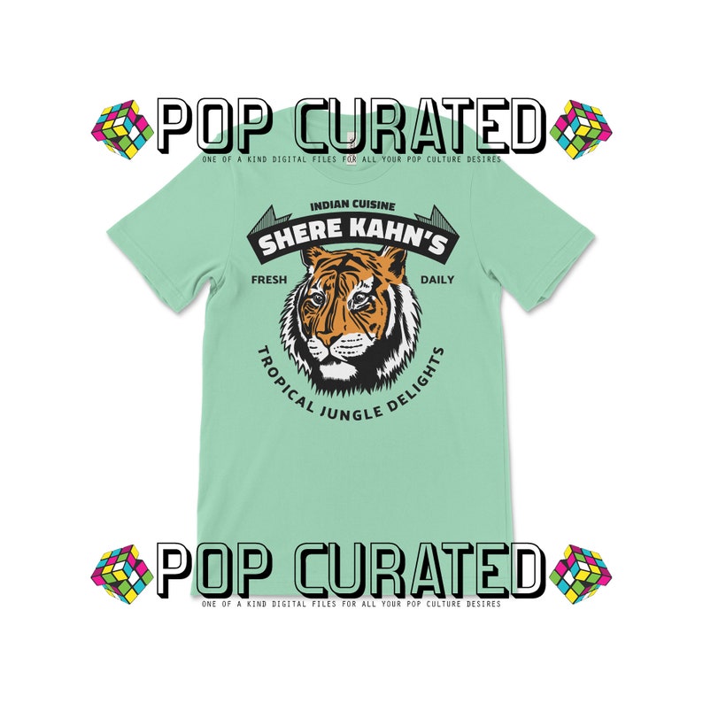 May include: A light green t-shirt with a tiger graphic and the text "Indian Cuisine Shere Kahn's Fresh Daily Tropical Jungle Delights".