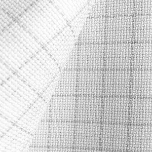 May include: Close-up of a textured fabric in shades of gray and white. The fabric has a woven appearance with a subtle grid pattern. The material is folded over, revealing the texture and weave.