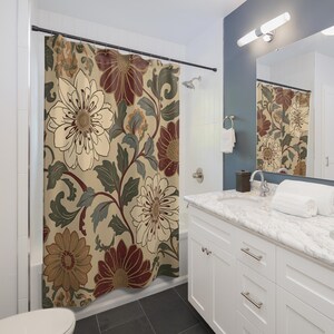 May include: A floral shower curtain featuring large, stylized flowers in cream, burgundy, and brown hues, set against a beige background. The design includes green leaves and stems, creating a botanical theme. The curtain hangs in a bathroom setting.