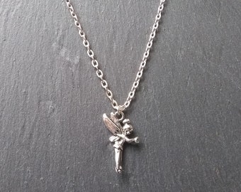 May include: A silver chain necklace with a small silver fairy pendant.