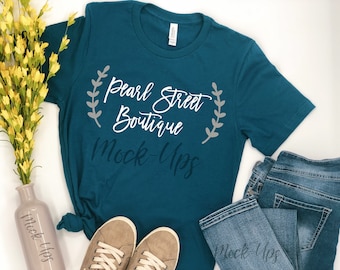 Download Free Mockup Deep Teal Bella Canvas Unisex Shirt, White Background, Flat-Lay, Flower Vase, Converse Tennis Style Shoes, Blue Jeans, Summer Spring PSD Template