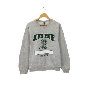 May include: Gray sweatshirt with a green and white graphic of a horse and the text "JOHN MUIR PE DEPT."