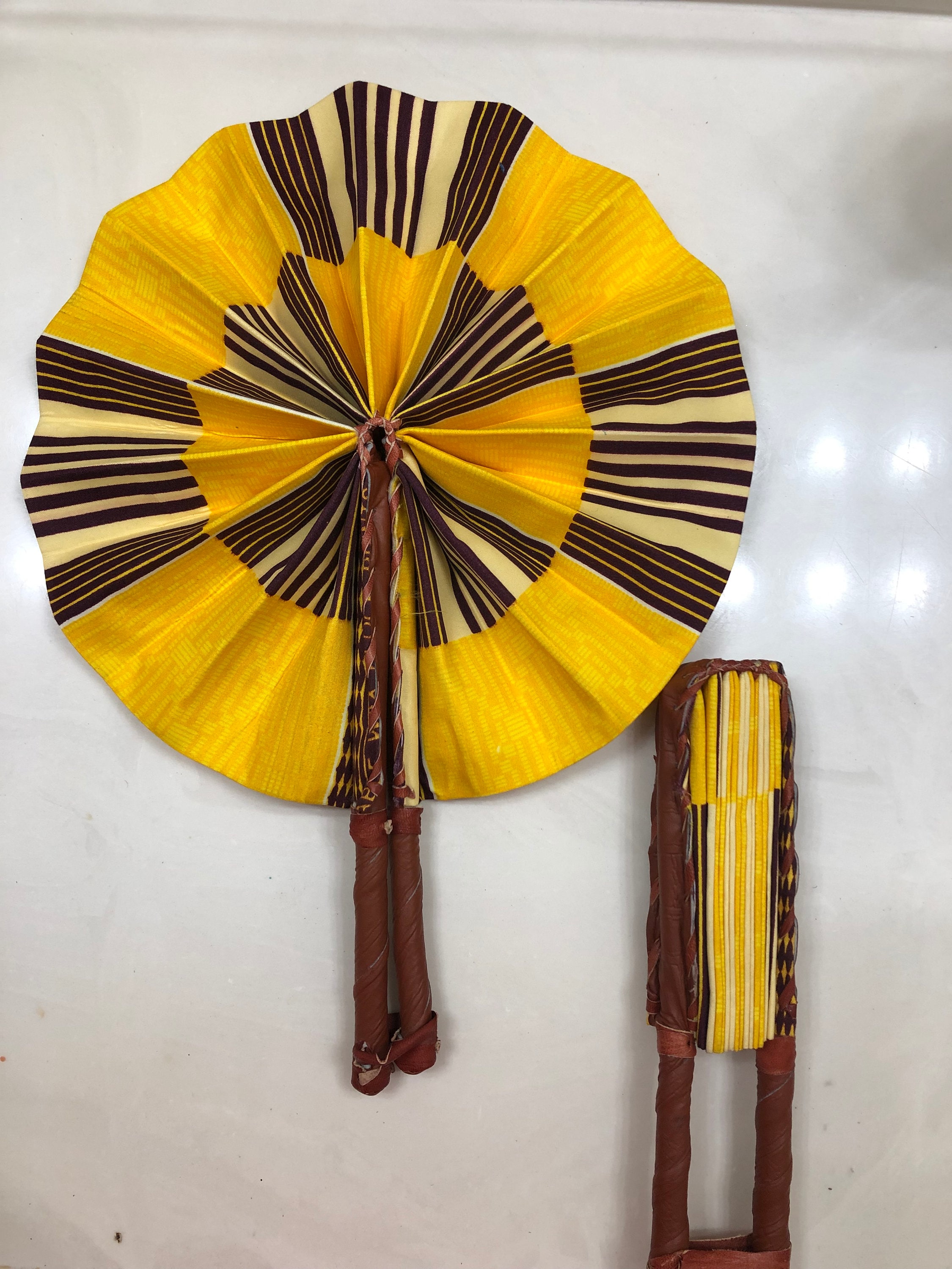 Black yellow Ankara african wedding favor ethnic print fabric round windmill style handmade hand fan with leather trim folding