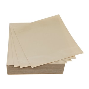 May include: A stack of beige-colored paper sheets, with several sheets fanned out on top. The paper has a smooth texture and appears to be new. The stack is rectangular and sits on a white background.