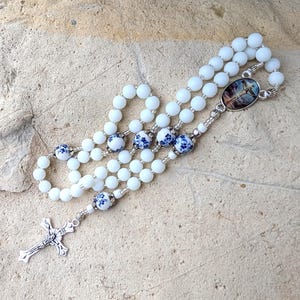 White Stone 5 Decades Rosary with Silvertone Crucifix and Medallion of Our Lady or Jesus at the Cross or an Guardian Angel
