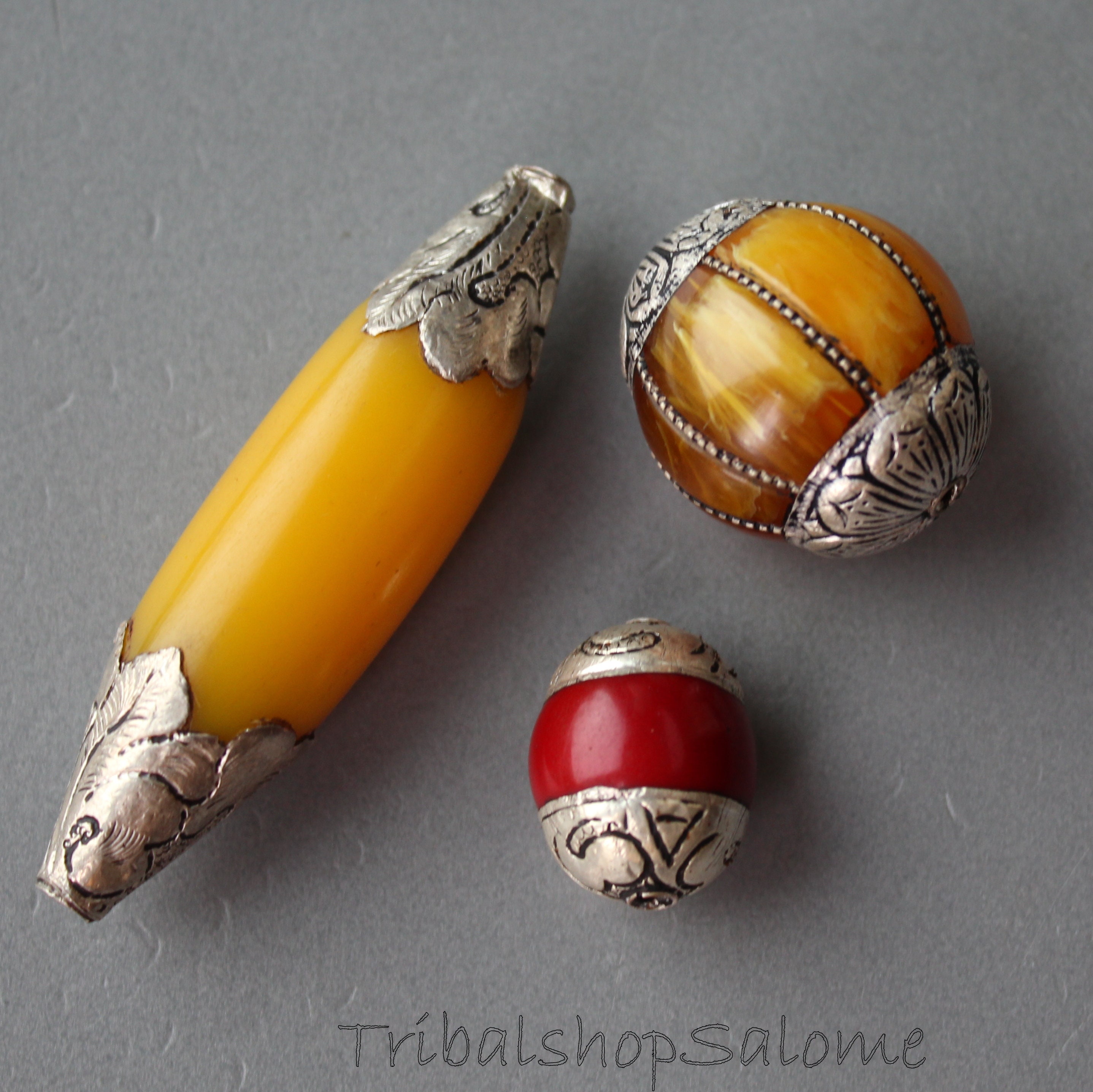 Vintage Tibetan Amber resin oval bead with coin silver bead caps