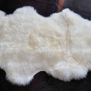 For That Perfect Extra Length - A 1 & 1/2 Skin Thick and Soft White Australian Sheepskin Rug