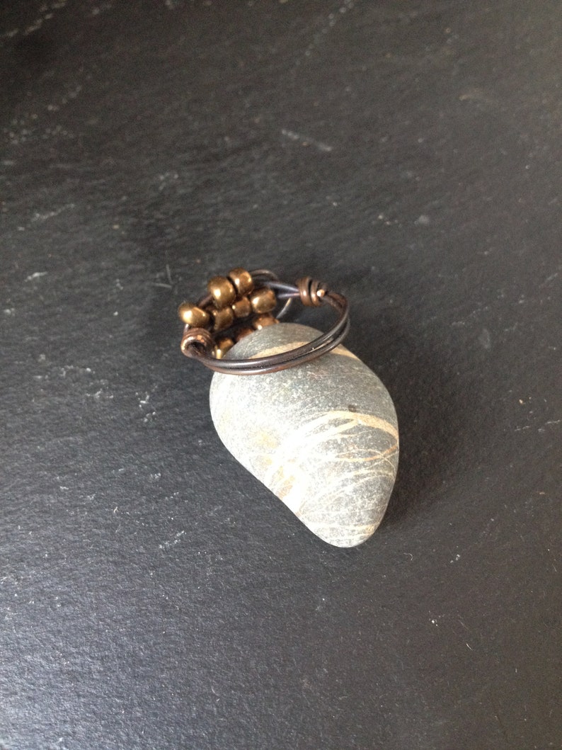 Copper ring with patina and bronze goldish colour beads