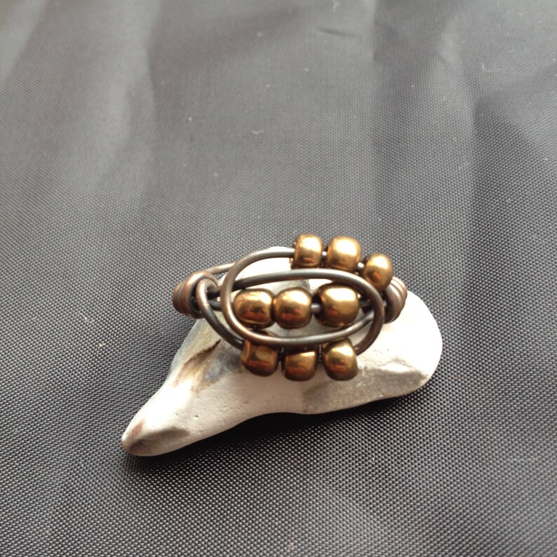 Copper ring with patina and bronze goldish colour beads