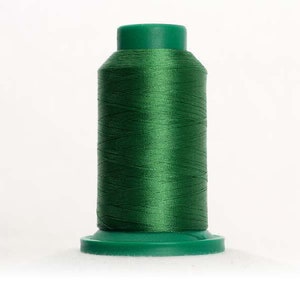 May include: A spool of green thread with a plastic bobbin.