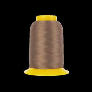 May include: A spool of brown thread with a yellow base and top. The thread is tightly wound around the spool, creating a smooth, cylindrical shape. The yellow base and top provide a contrasting color to the brown thread.