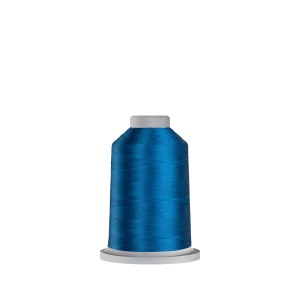 May include: A spool of bright blue embroidery thread.