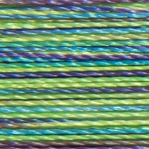 May include: A close-up of a spool of iridescent thread with a mix of green, blue, and purple colors.