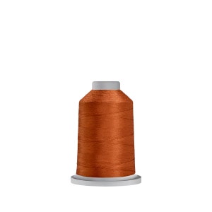 May include: A spool of orange thread on a white bobbin.