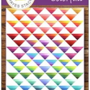 May include: A quilting pattern called "Ombre Colorfall" by Maywood Studio. The pattern features a colorful ombre design with triangles in shades of red, orange, yellow, green, blue, purple, and pink.