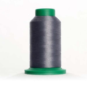 May include: A spool of gray thread with a green plastic top and bottom. The thread is wound around a plastic bobbin.