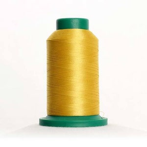 May include: A spool of yellow thread with a green plastic bobbin.
