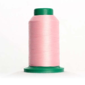 May include: A spool of pink thread with a green plastic top and bottom.