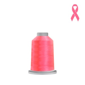 May include: A spool of pink thread for sewing or embroidery.
