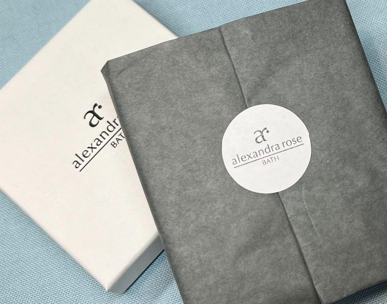 May include: Two white boxes with black text. The text on the top box reads "ar. alexandra bath". The text on the bottom box reads "ar. alexandra rose bath".