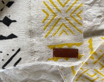 Mudcloth Faux Fur Blanket in Natural with Black and Yellow Stamping