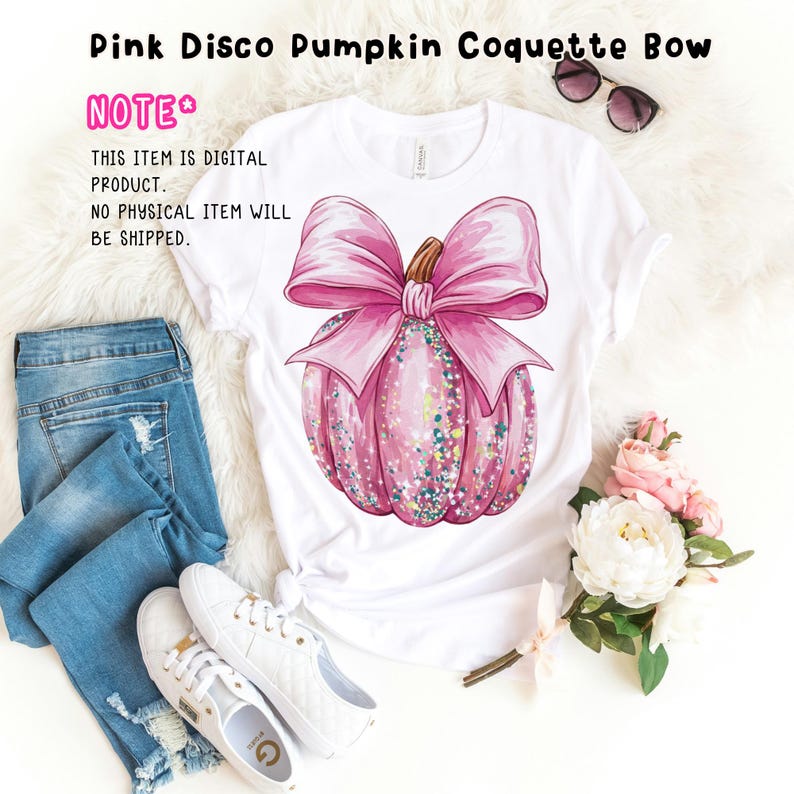 May include: A white t-shirt featuring a pink glitter pumpkin with a pink bow on top. The text "NOTE* THIS ITEM IS DIGITAL PRODUCT. NO PHYSICAL ITEM WILL BE SHIPPED." is printed on the shirt.