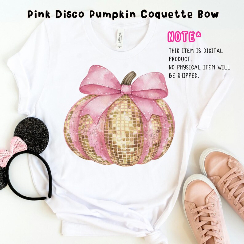 May include: A white t-shirt featuring a pink and gold glitter pumpkin with a pink bow. The text "NOTE* THIS ITEM IS DIGITAL PRODUCT. NO PHYSICAL ITEM WILL BE SHIPPED." is on the shirt.