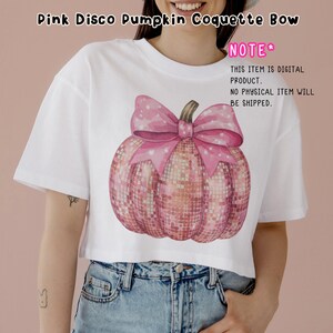 May include: A white crop top featuring a pink glitter pumpkin with a pink bow. The text "NOTE* THIS ITEM IS DIGITAL PRODUCT. NO PHYSICAL ITEM WILL BE SHIPPED." is on the right side of the image.
