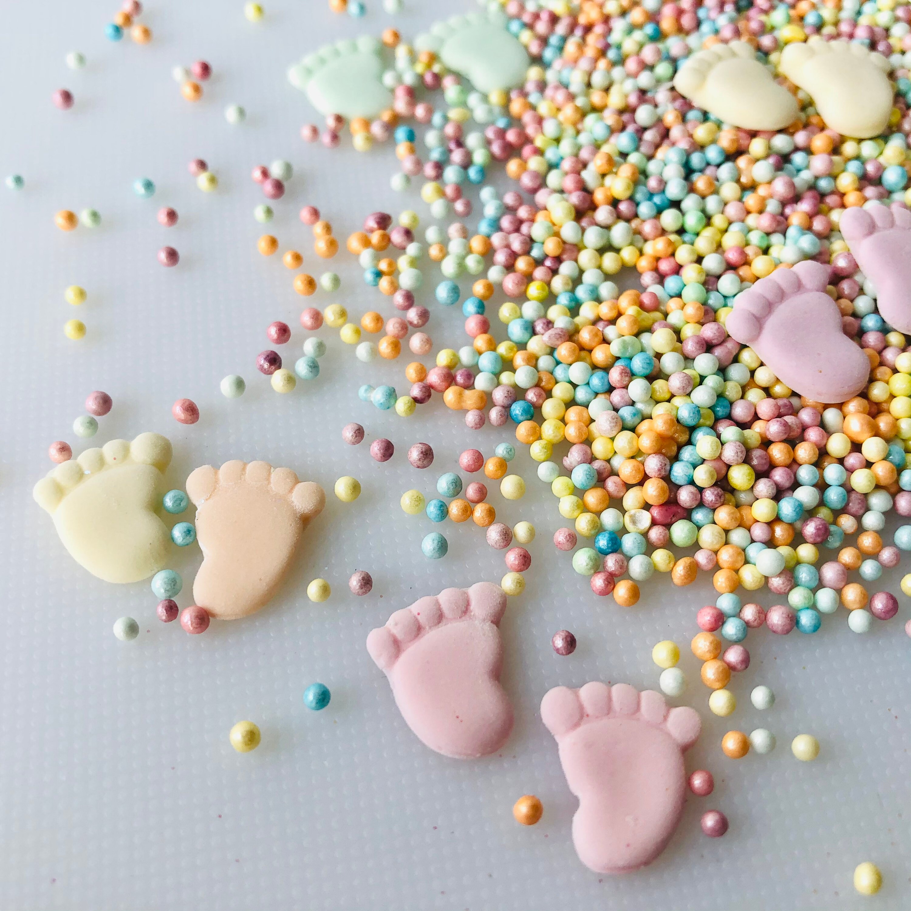 Baby feet pastel sprinkles/cake toppers. Etsy