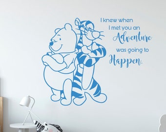 May include: A blue Winnie the Pooh and Tigger wall decal with the quote "I knew when I met you an Adventure was going to Happen."